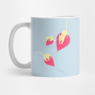 Mischievous kittens adrift on balloons Mug